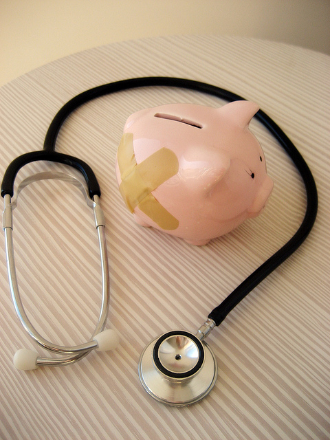 Stethescope and Piggy Bank with a Bandaid on it